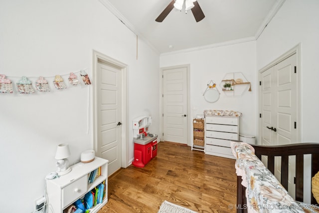 905 W Elmira St, Broken Arrow, OK 74012 - bedroom with crown molding, wood finished floors, and ceiling fan