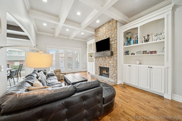 905 W Elmira St, Broken Arrow, OK 74012 - living area featuring light wood-style flooring, beamed ceiling, coffered ceiling, a stone fireplace, and recessed lighting