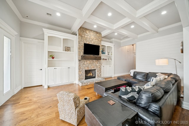 905 W Elmira St, Broken Arrow, OK 74012 - living room with a stone fireplace, coffered ceiling, beam ceiling, ornamental molding, and wood finished floors