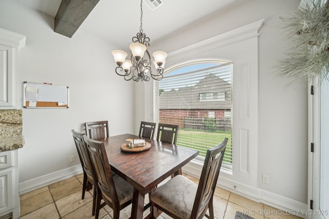 905 W Elmira St, Broken Arrow, OK 74012 - dining area with a chandelier and stone tile flooring