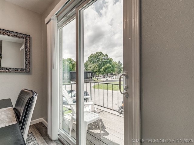 4640 E 68th St Unit 285, Tulsa, OK 74136 - entryway featuring plenty of natural light, wood finished floors, and a textured wall