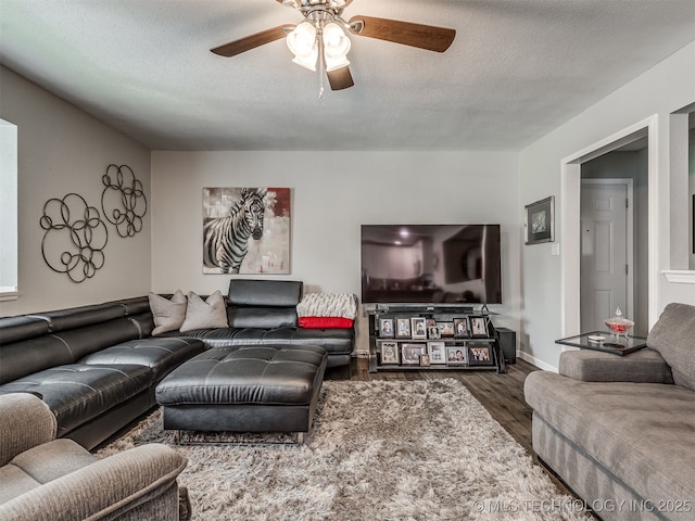 4640 E 68th St Unit 285, Tulsa, OK 74136 - living room featuring wood finished floors, a ceiling fan, and a textured ceiling