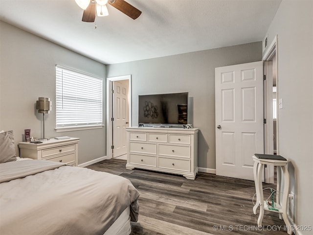 4640 E 68th St Unit 285, Tulsa, OK 74136 - bedroom with dark wood-type flooring and a ceiling fan