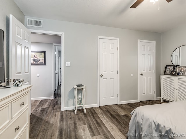4640 E 68th St Unit 285, Tulsa, OK 74136 - bedroom with dark wood-style flooring and a ceiling fan