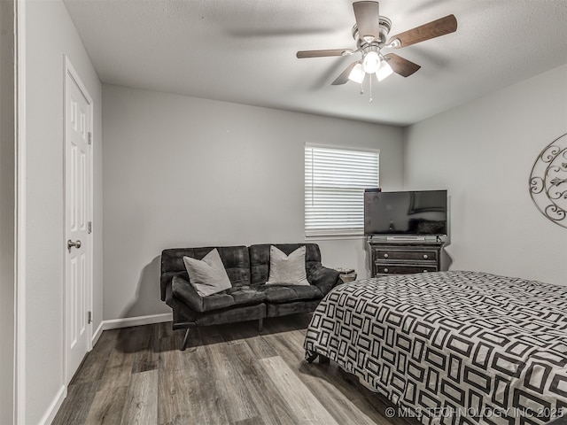 4640 E 68th St Unit 285, Tulsa, OK 74136 - bedroom with wood finished floors and ceiling fan
