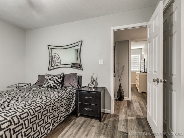 4640 E 68th St Unit 285, Tulsa, OK 74136 - bedroom with wood finished floors