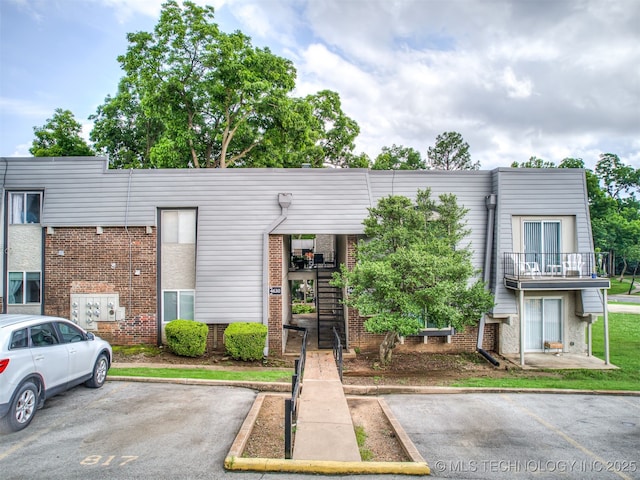 4640 E 68th St Unit 185, Tulsa, OK 74136 - view of building exterior featuring uncovered parking