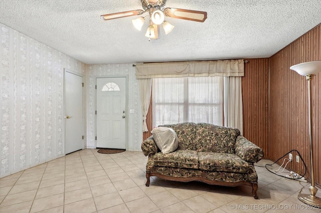 16429 E 1st St, Tulsa, OK 74108 - foyer entrance with wallpapered walls, a textured ceiling, and a ceiling fan