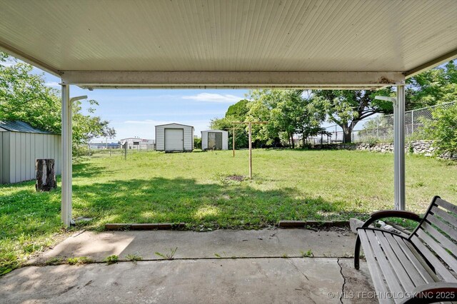 16429 E 1st St, Tulsa, OK 74108 - view of yard with a storage unit and a patio area