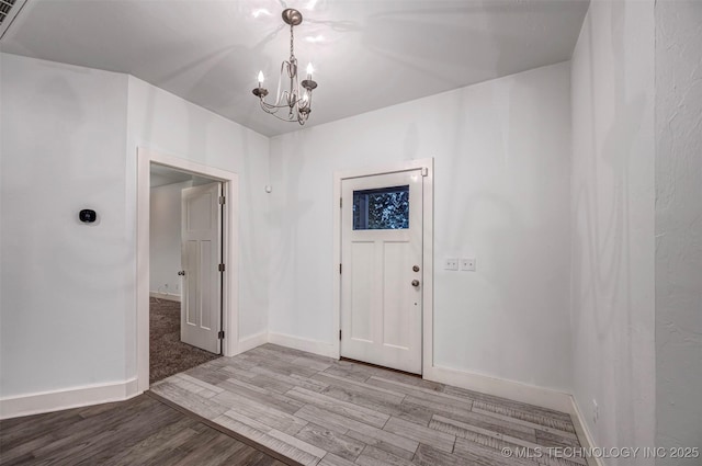 1341 Alvera Ln, Wynnewood, OK 73098 - entryway featuring a chandelier and light wood-type flooring