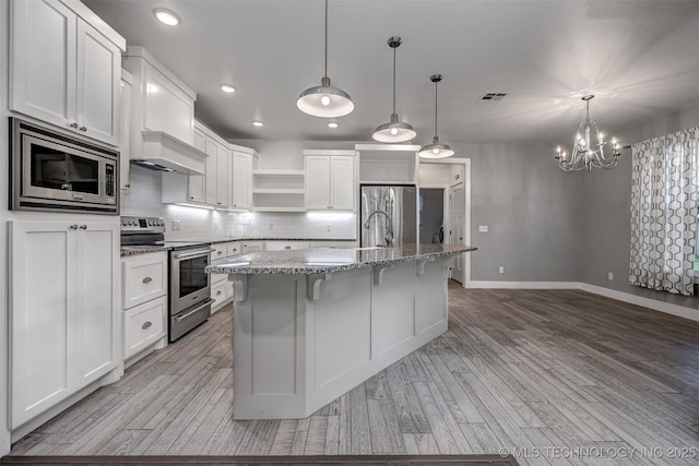 1341 Alvera Ln, Wynnewood, OK 73098 - kitchen featuring appliances with stainless steel finishes, open shelves, white cabinets, backsplash, and recessed lighting