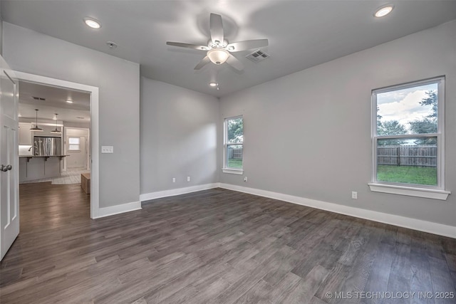 1341 Alvera Ln, Wynnewood, OK 73098 - unfurnished room with a ceiling fan, dark wood-type flooring, a pendent fire sprinkler, and recessed lighting