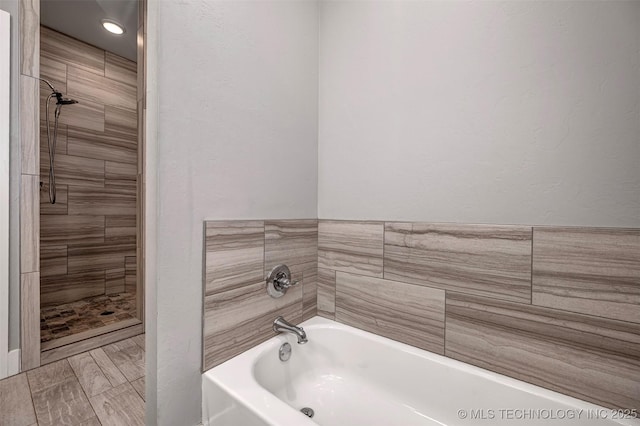 1341 Alvera Ln, Wynnewood, OK 73098 - bathroom featuring a bath and a tile shower