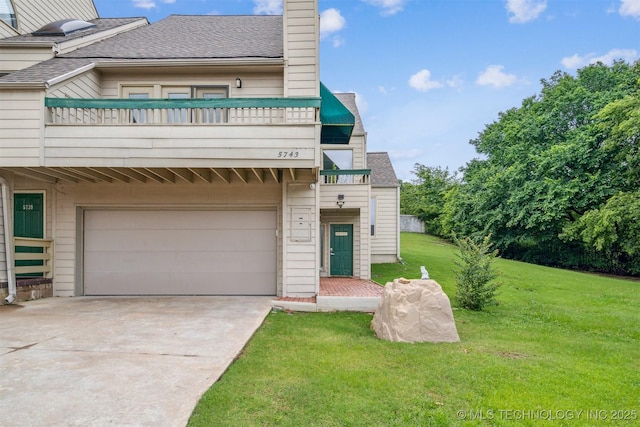 5743 E 72nd Pl Unit 11, Tulsa, OK 74136 - multi unit property featuring a garage, driveway, a balcony, a front yard, and a shingled roof