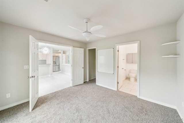 5743 E 72nd Pl Unit 11, Tulsa, OK 74136 - unfurnished bedroom with stainless steel refrigerator with ice dispenser, carpet, ensuite bathroom, and ceiling fan