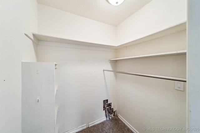 5743 E 72nd Pl Unit 11, Tulsa, OK 74136 - laundry room with carpet and baseboards