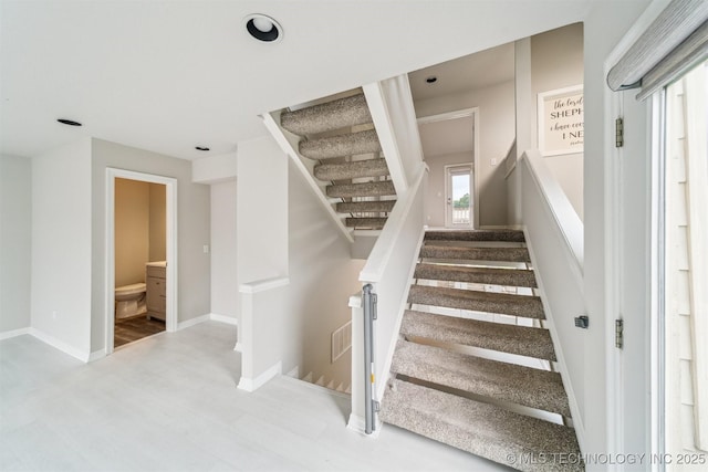 5743 E 72nd Pl Unit 11, Tulsa, OK 74136 - stairs featuring wood finished floors and recessed lighting