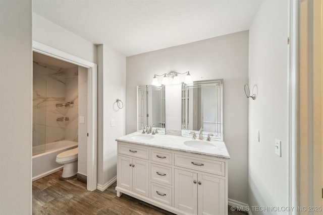 5743 E 72nd Pl Unit 11, Tulsa, OK 74136 - full bath featuring double vanity, wood finished floors, and washtub / shower combination