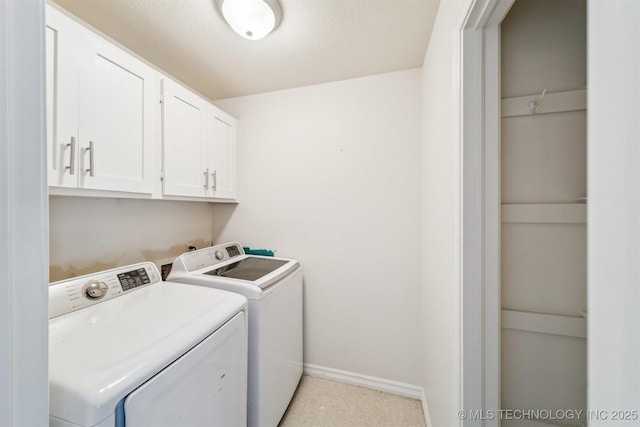 5743 E 72nd Pl Unit 11, Tulsa, OK 74136 - laundry room featuring separate washer and dryer and cabinet space