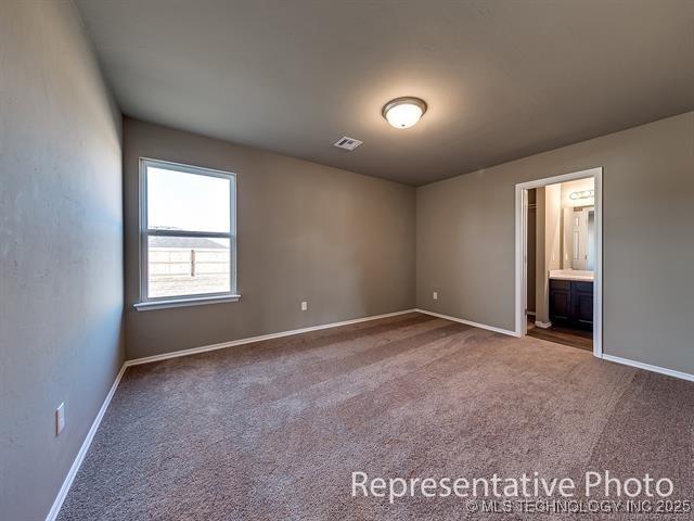 1405 E 83rd St, Broken Arrow, OK 74014 - carpeted empty room with baseboards