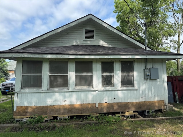 804 N Oklahoma St, Okmulgee, OK 74447 - view of home's exterior with a shingled roof