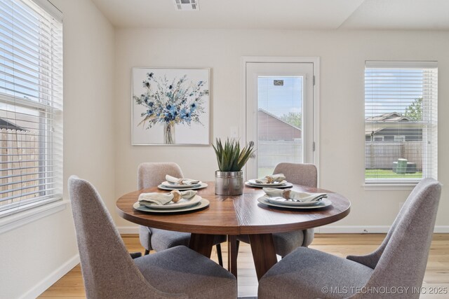 2211 E Concord Pl, Broken Arrow, OK 74012 - dining space with light wood-style floors and plenty of natural light