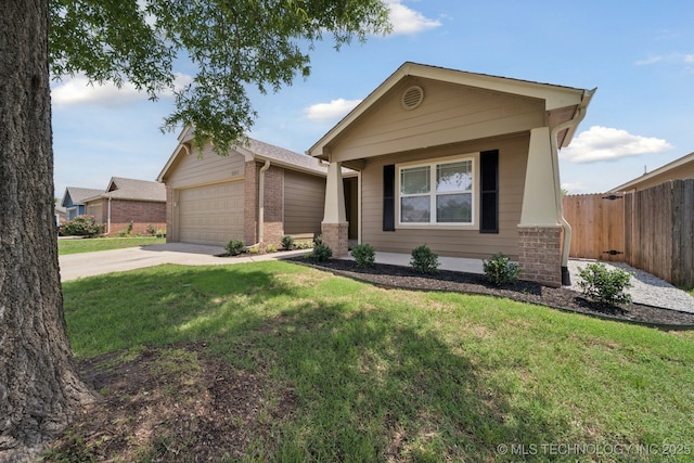 2211 E Concord Pl, Broken Arrow, OK 74012 - view of front facade with concrete driveway, a garage, brick siding, and covered porch
