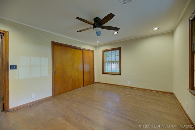 583 S Joplin Ave, Tulsa, OK 74112 - unfurnished bedroom featuring wood finished floors, a closet, ornamental molding, recessed lighting, and ceiling fan