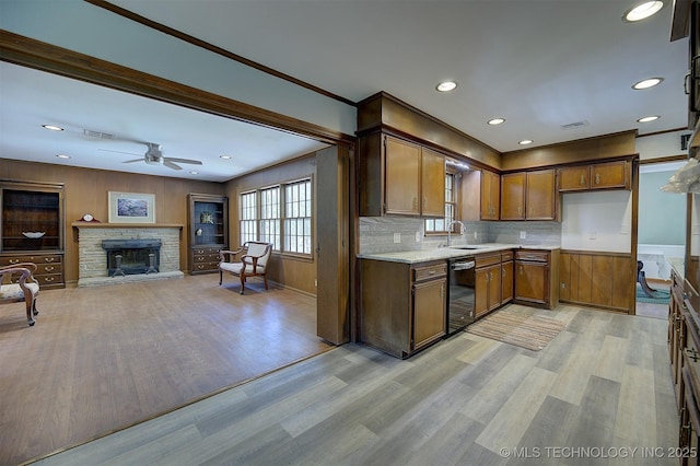 583 S Joplin Ave, Tulsa, OK 74112 - kitchen featuring light wood-style flooring, a fireplace, tasteful backsplash, ceiling fan, and recessed lighting