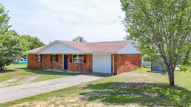 3700 Bloomfield Loop, Ada, OK 74820 - ranch-style home with a garage, a front lawn, brick siding, and driveway