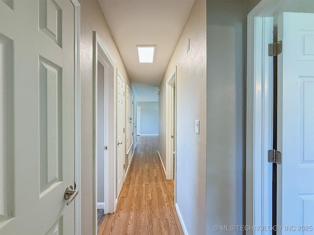 3700 Bloomfield Loop, Ada, OK 74820 - hallway featuring light wood finished floors and baseboards