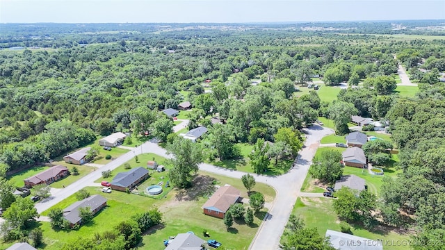3700 Bloomfield Loop, Ada, OK 74820 - aerial perspective of suburban area featuring a heavily wooded area