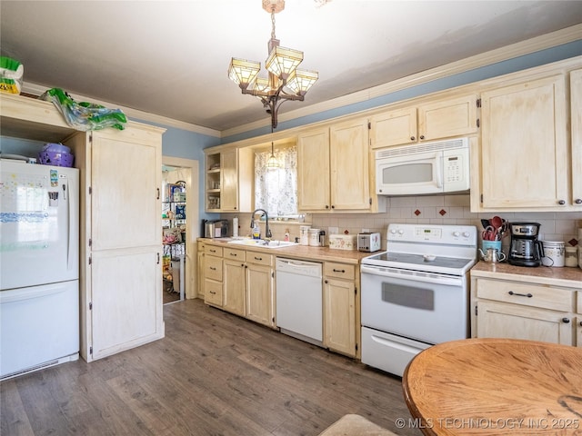 621 E Seminole Ave, Mcalester, OK 74501 - kitchen featuring white appliances, light brown cabinets, ornamental molding, light countertops, and dark wood-style floors
