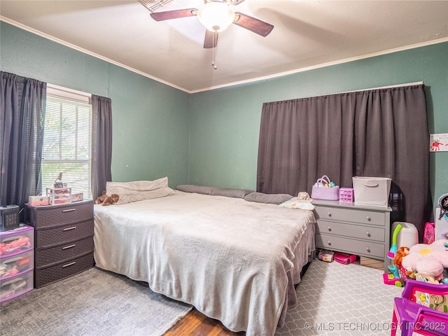 621 E Seminole Ave, Mcalester, OK 74501 - bedroom with ornamental molding and a ceiling fan