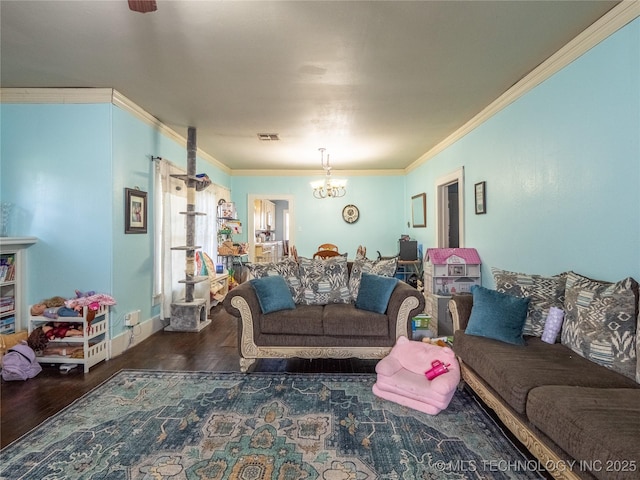 621 E Seminole Ave, Mcalester, OK 74501 - living area with wood finished floors, crown molding, and a chandelier