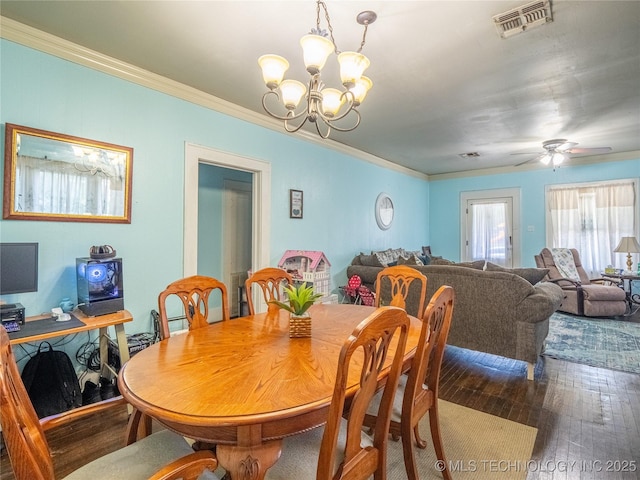 621 E Seminole Ave, Mcalester, OK 74501 - dining room featuring hardwood / wood-style flooring, a chandelier, crown molding, and a ceiling fan