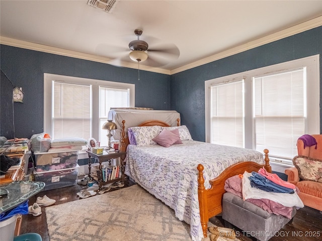 621 E Seminole Ave, Mcalester, OK 74501 - bedroom featuring wood finished floors, crown molding, and ceiling fan