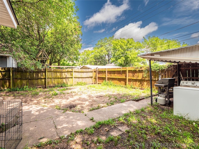621 E Seminole Ave, Mcalester, OK 74501 - fenced backyard with washer / dryer