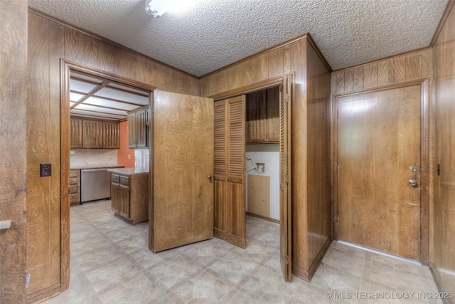 28265 Forest Ridge Rd, Sand Springs, OK 74063 - hallway featuring wooden walls and a textured ceiling