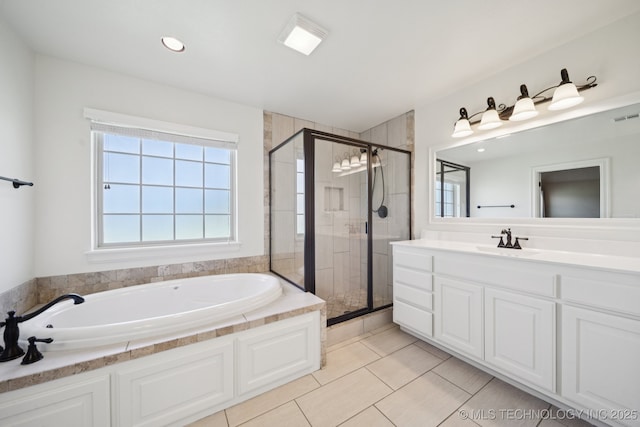 5814 130th W Ave, Sand Springs, OK 74063 - full bathroom featuring a garden tub, healthy amount of natural light, a stall shower, and vanity