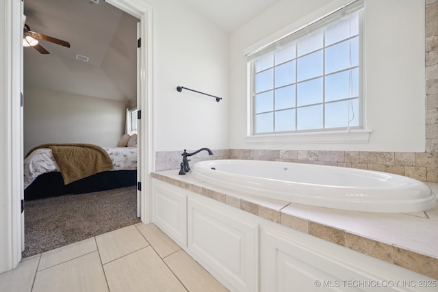 5814 130th W Ave, Sand Springs, OK 74063 - ensuite bathroom with a bath, a ceiling fan, lofted ceiling, and tile patterned floors