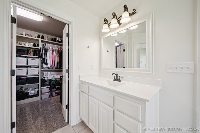 5814 130th W Ave, Sand Springs, OK 74063 - bathroom with vanity, tile patterned floors, and a spacious closet