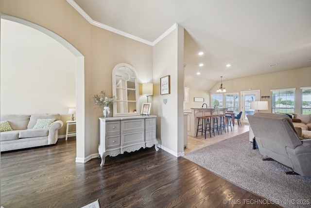 5814 130th W Ave, Sand Springs, OK 74063 - living room featuring crown molding, wood finished floors, arched walkways, recessed lighting, and a chandelier