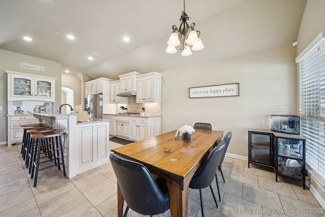5814 130th W Ave, Sand Springs, OK 74063 - dining area with vaulted ceiling, a chandelier, and recessed lighting