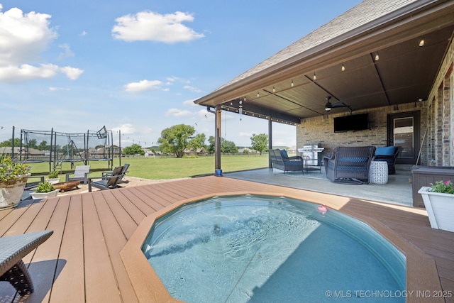 5814 130th W Ave, Sand Springs, OK 74063 - view of pool featuring a deck, ceiling fan, a yard, and an outdoor hangout area