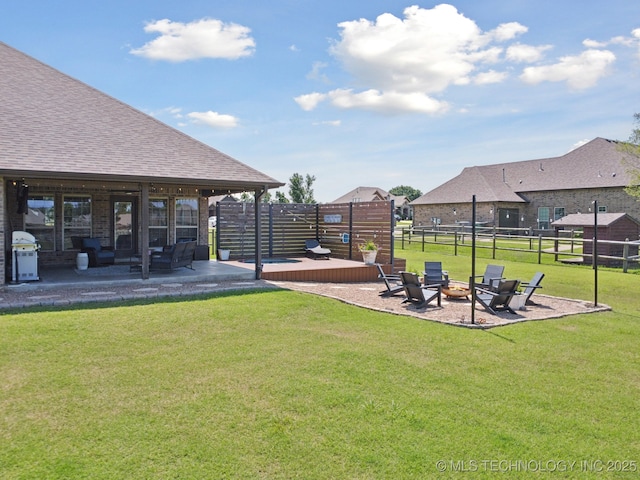 5814 130th W Ave, Sand Springs, OK 74063 - fenced backyard with a patio and an outdoor living space with a fire pit