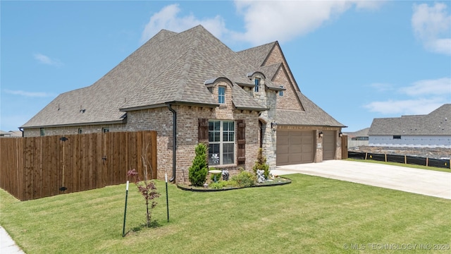 14934 S Sequoia St, Glenpool, OK 74033 - french provincial home featuring driveway, roof with shingles, brick siding, and an attached garage