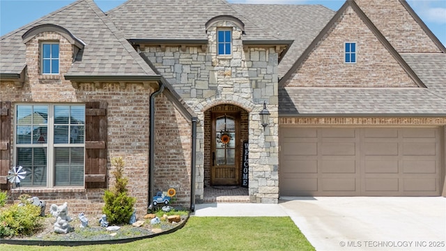 14934 S Sequoia St, Glenpool, OK 74033 - view of front of house with a shingled roof, driveway, brick siding, and a garage