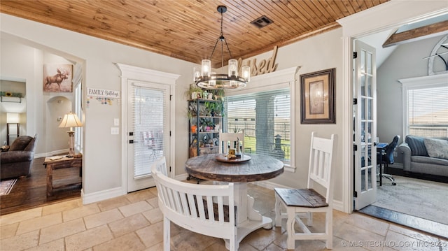 14934 S Sequoia St, Glenpool, OK 74033 - dining area with a chandelier, stone tile floors, wooden ceiling, crown molding, and lofted ceiling