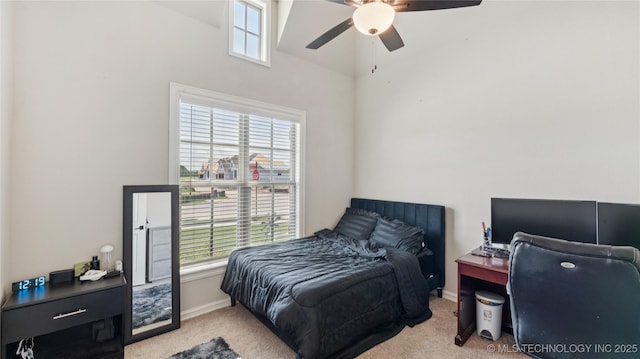 14934 S Sequoia St, Glenpool, OK 74033 - bedroom featuring carpet, multiple windows, a towering ceiling, and a ceiling fan